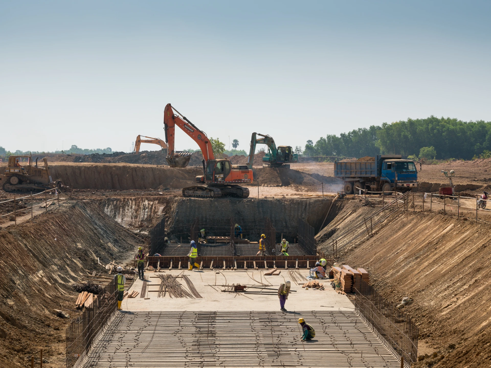 Construction site with heavy machinery and workers